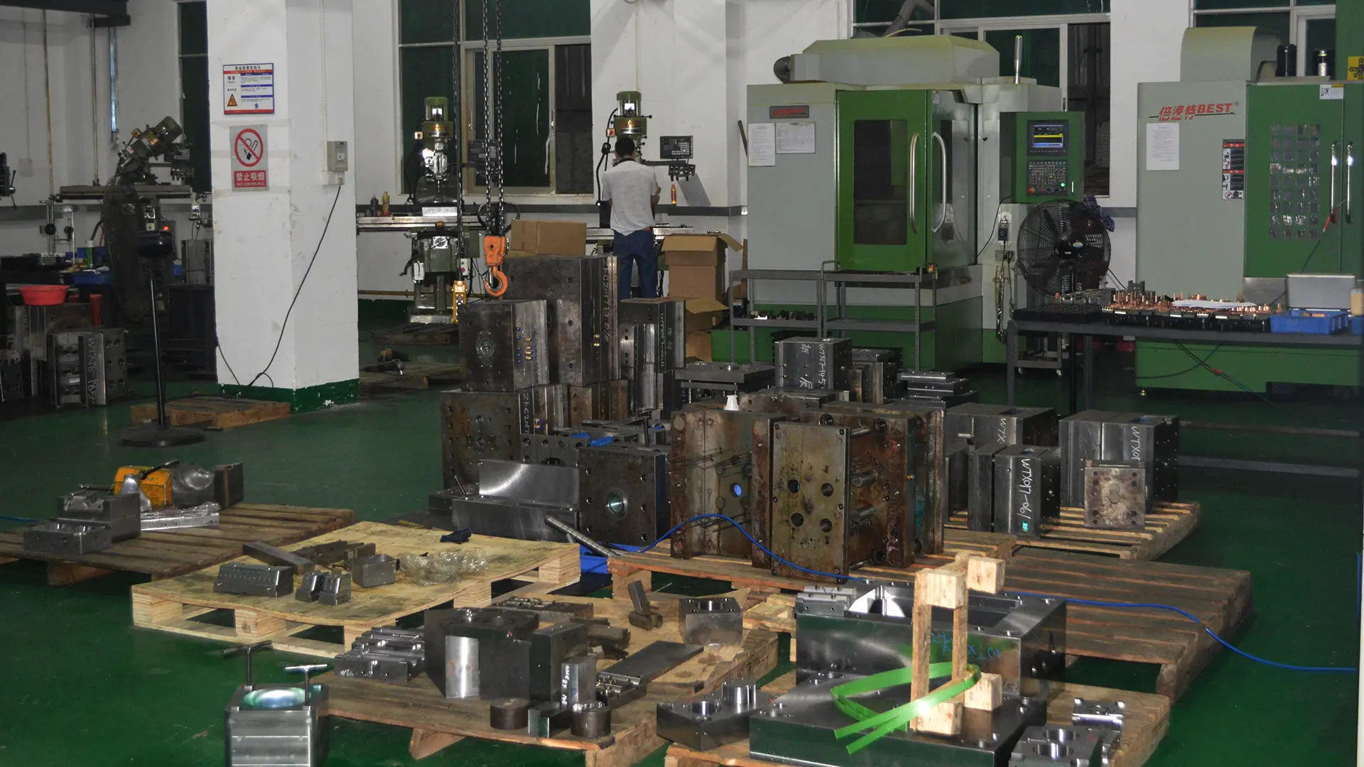 Precision mold making and tooling shop with CNC machines and skilled technicians for injection molding tooling